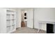 Bright office space featuring built-in shelving, a modern desk, and an open doorway at 6843 Black Cherry Ter, Brownsburg, IN 46112