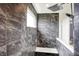 Modern tiled shower features shower head and built-in bench at 6843 Black Cherry Ter, Brownsburg, IN 46112