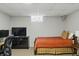 Finished basement with natural lighting, a bed, and entertainment center at 7060 N Park Ave, Indianapolis, IN 46220