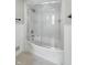 Bathroom featuring tiled shower and tub, chrome fixtures and bright lighting at 7060 N Park Ave, Indianapolis, IN 46220