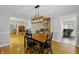 Open-concept dining room with hardwood floors and direct access to living spaces at 7060 N Park Ave, Indianapolis, IN 46220