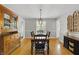 Dining room with hardwood floors and an elegant chandelier at 7060 N Park Ave, Indianapolis, IN 46220