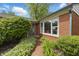 Welcoming front entrance with brick walkway and lush landscaping at 7060 N Park Ave, Indianapolis, IN 46220