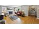 Bright living room with hardwood floors, fireplace, and large windows at 7060 N Park Ave, Indianapolis, IN 46220