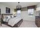 Charming bedroom with a modern light fixture and a comfortable bed, perfect for relaxation at 7239 Barrett Dr, Brownsburg, IN 46112