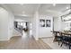Open-concept dining room features stylish decor and a rustic wood table, ideal for Gathering gatherings at 7239 Barrett Dr, Brownsburg, IN 46112