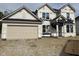 New construction of a two story home with an attached two car garage and unfinished landscaping at 7239 Barrett Dr, Brownsburg, IN 46112