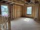 Interior view of unfinished room. Construction shows exposed studs, wiring, and framing at 7239 Barrett Dr, Brownsburg, IN 46112