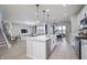 Open concept kitchen has a large island, stainless steel appliances, and access to the living area at 7239 Barrett Dr, Brownsburg, IN 46112