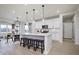 The expansive kitchen offers an eat-in island with modern pendant lights and stainless appliances at 7239 Barrett Dr, Brownsburg, IN 46112