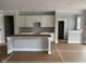 Bright kitchen featuring white cabinets, an island with seating and lots of natural light at 7239 Barrett Dr, Brownsburg, IN 46112