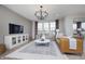 Spacious living room with large windows, hardwood floors, and contemporary decor, perfect for relaxing at 7239 Barrett Dr, Brownsburg, IN 46112