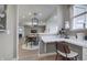 Open-concept office space with views into a stylish dining and living area, perfect for working from home at 7239 Barrett Dr, Brownsburg, IN 46112