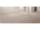 Finished basement with neutral carpet and paint, and support beams throughout at 7406 N Washington Blvd, Indianapolis, IN 46240