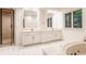 Bathroom features dual sinks, a glass enclosed shower, and a soaking tub with jets at 7406 N Washington Blvd, Indianapolis, IN 46240