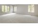 Bright bedroom featuring neutral carpet and many windows providing ample natural light at 7406 N Washington Blvd, Indianapolis, IN 46240
