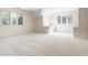 Bright bedroom featuring carpet, white trim and built-in shelves with desk at 7406 N Washington Blvd, Indianapolis, IN 46240
