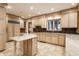 Kitchen featuring custom cabinets, light countertops, and a central island at 7406 N Washington Blvd, Indianapolis, IN 46240