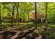 Mature trees surround the home, offering a peaceful retreat at 7406 N Washington Blvd, Indianapolis, IN 46240