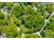 Aerial view of the property showcasing the landscaped lot, mature trees and driveway at 7595 Heather Dr, Nineveh, IN 46164