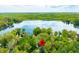 Stunning aerial view of the property with lake access and mature trees surrounding the home at 7595 Heather Dr, Nineveh, IN 46164