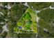 Aerial view of the property showcasing the landscaped lot, mature trees and driveway at 7595 Heather Dr, Nineveh, IN 46164