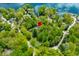 Aerial view of the property showcasing lake access, mature trees and quiet neighborhood at 7595 Heather Dr, Nineveh, IN 46164