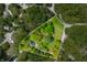 Aerial view of the property showcasing the landscaped lot, mature trees and driveway at 7595 Heather Dr, Nineveh, IN 46164