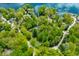 Aerial view of the property showcasing lake access, mature trees and quiet neighborhood at 7595 Heather Dr, Nineveh, IN 46164