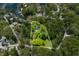An aerial view of a wooded property with a defined property line and lake access at 7595 Heather Dr, Nineveh, IN 46164