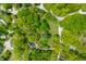 Aerial view of the property showcasing the landscaped lot, mature trees and driveway at 7595 Heather Dr, Nineveh, IN 46164