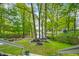Stairway leading to backyard with lake views and mature trees at 7595 Heather Dr, Nineveh, IN 46164