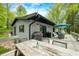 A view of the backyard deck with seating, barbecue, and dining area; ideal for outdoor gatherings and relaxation at 7595 Heather Dr, Nineveh, IN 46164