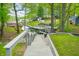 Stairway leading to backyard with lake views and mature trees at 7595 Heather Dr, Nineveh, IN 46164
