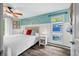 Bright bedroom featuring wood-look floors, nautical decor, and a large window offering scenic views at 7595 Heather Dr, Nineveh, IN 46164