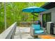 Charming deck with dining table and chairs, plus a seating area, perfect for enjoying nature and outdoor dining at 7595 Heather Dr, Nineveh, IN 46164