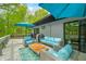 Spacious deck featuring comfortable seating areas, a grill, and views of the surrounding trees at 7595 Heather Dr, Nineveh, IN 46164