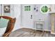 Welcoming entryway featuring a round window, neutral decor, and hardwood flooring at 7595 Heather Dr, Nineveh, IN 46164