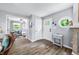 Bright entryway with hardwood floors, decorative accents, and a view into the bedroom at 7595 Heather Dr, Nineveh, IN 46164