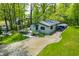 A well-maintained home exterior featuring a cozy deck and lush green surroundings at 7595 Heather Dr, Nineveh, IN 46164