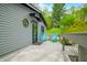 Charming exterior with a round window and teal Adirondack chairs at 7595 Heather Dr, Nineveh, IN 46164