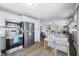 Kitchen with stainless steel appliances, island with breakfast bar and views into living area at 7595 Heather Dr, Nineveh, IN 46164