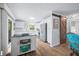 Well-lit kitchen featuring white cabinets, a movable island, and stainless steel appliances at 7595 Heather Dr, Nineveh, IN 46164