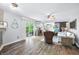 Bright living room featuring hardwood floors, modern decor, and sliding doors to the outdoor deck at 7595 Heather Dr, Nineveh, IN 46164