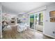 Living space with bar seating, fireplace and large sliding glass doors leading to a deck at 7595 Heather Dr, Nineveh, IN 46164
