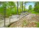 Stairway with landscaped retaining walls and stone, leading to the house, and outdoor living space at 7595 Heather Dr, Nineveh, IN 46164