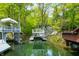 Idyllic waterfront view showcasing private boat docks and lush greenery offering an exceptional outdoor lifestyle at 7595 Heather Dr, Nineveh, IN 46164