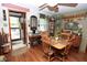 View of the dining area showcasing the natural light and charming decor with wooden accents and plants at 76 Manhattan Ave, Indianapolis, IN 46241