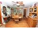 Cozy dining room with wood floors, table, and ceiling fan for a warm, inviting atmosphere at 76 Manhattan Ave, Indianapolis, IN 46241