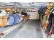 Uncluttered garage with overhead door; potential for vehicle storage or home projects at 76 Manhattan Ave, Indianapolis, IN 46241